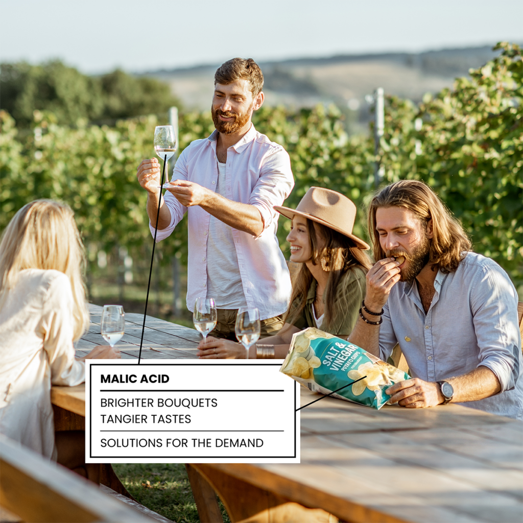 Friends enjoying food and wine at a winery